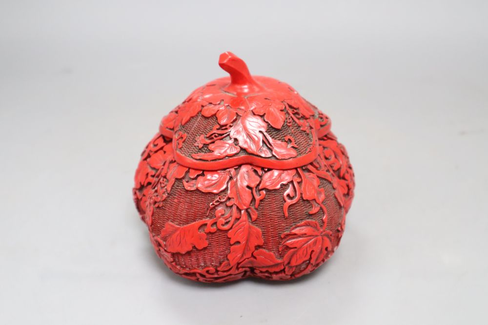 A Chinese cinnabar style box in the form of a fruit, height 12cm